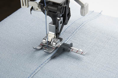 Guide pour machine a coudre