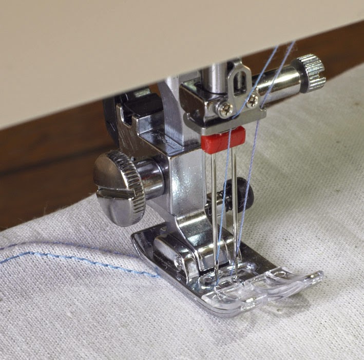 Machine a coudre a double aiguille